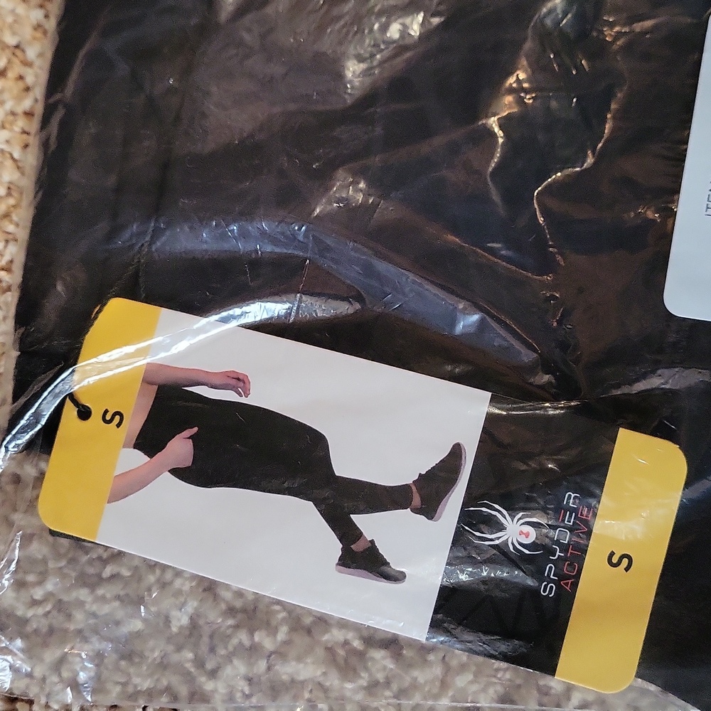 See Other Listing For This Item.NWT SPYDER active leggings, black print, pockets - Picture 10 of 11